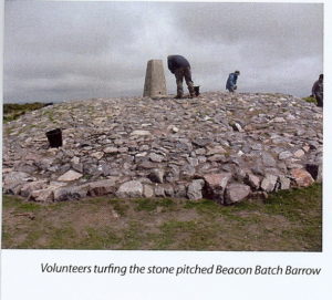 Volunteers turfing the newly stone-pitched Beacon Batch Barrow.